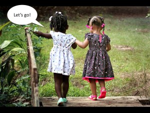 children hold hands going into the future